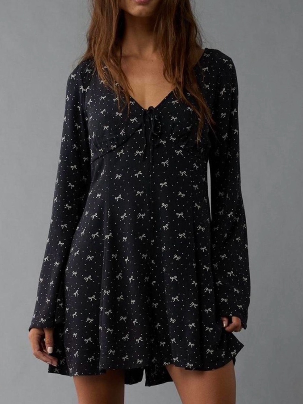 Black Long-Sleeve V-Neck Romper with Bow Print